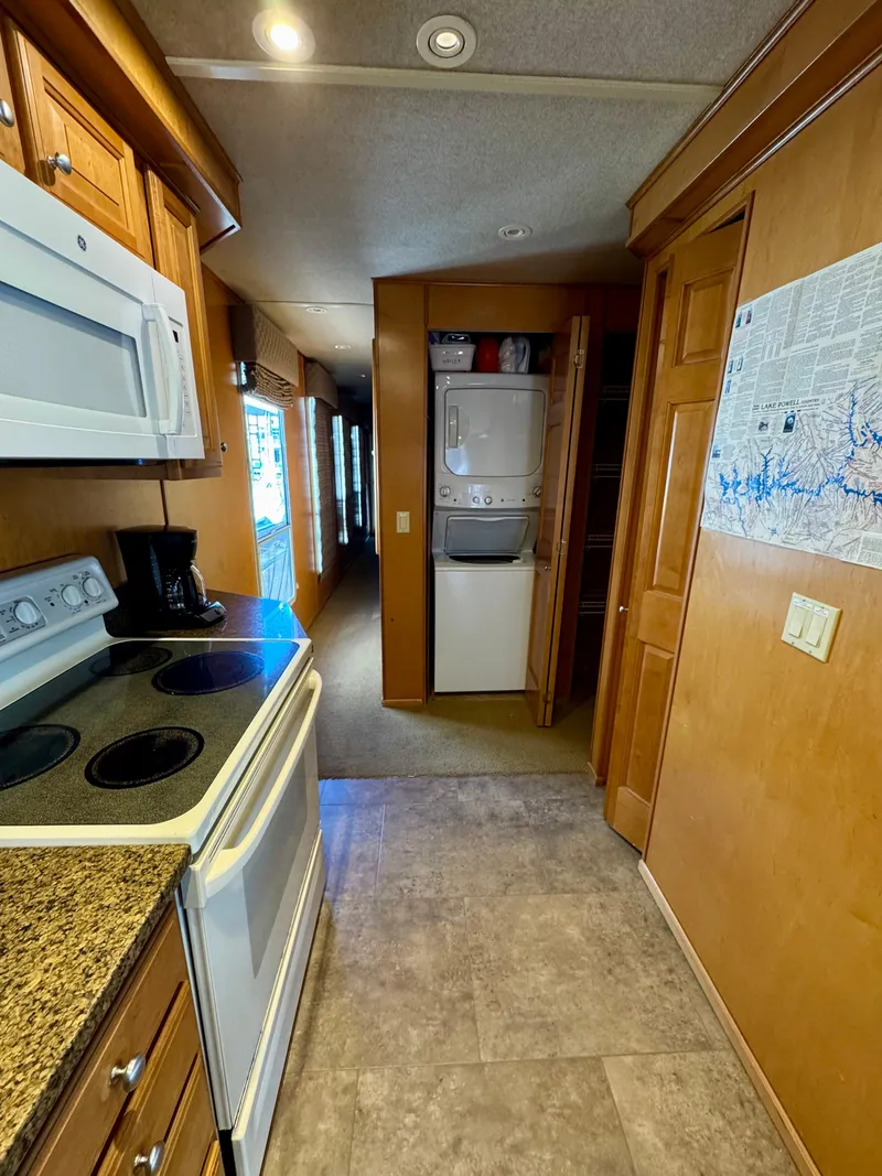 Slide: The Image of Compact kitchen with white appliances and stacked washer-dryer in a 2003 Sharpe Wailea Trip. - 18