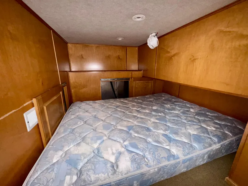 Slide: The Image of Compact wooden interior with a mattress in a 2003 Sharpe Wailea Trip model. - 24