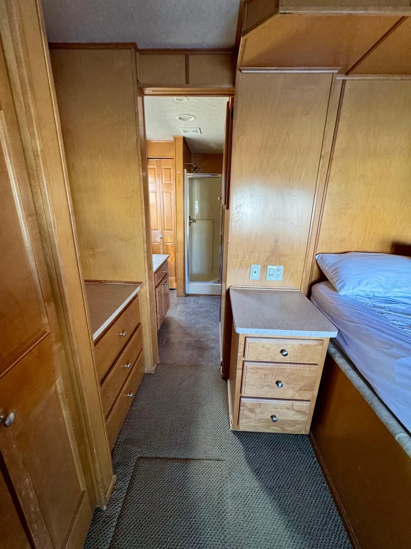 Slide: The Image of Interior of 2003 Sharpe Wailea Trip, featuring wooden cabinetry and cozy bedroom space. - 26