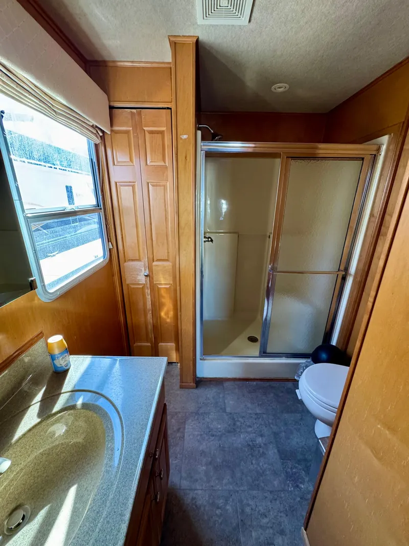 Slide: The Image of 2003 Sharpe Wailea bathroom with shower, sink, and toilet in compact layout. - 27