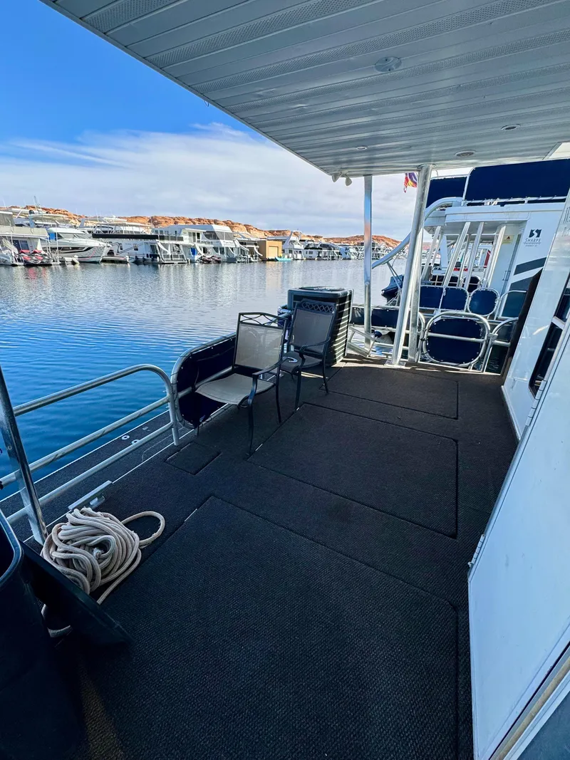 Slide: The Image of Houseboat deck with chairs, overlooking marina; Sharpe Wailea Trip, 2003 model. - 28
