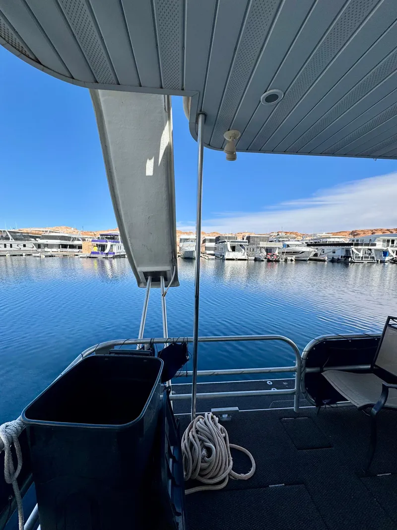 Slide: The Image of Houseboat deck view with calm water and marina, Sharpe Wailea Trip 2003 model. - 29