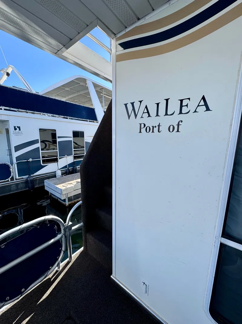 Slide: The Image of Boat docked at Wailea Port, featuring Sharpe model Wailea Trip #11, #24 & #37, 2003. - 30