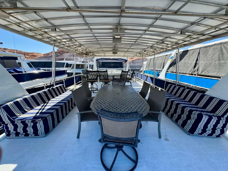 Slide: The Image of Spacious deck of 2003 Sharpe Wailea Trip houseboat with seating and dining area. - 32
