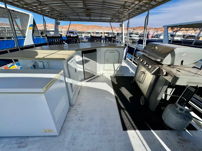 Slide: The Image of Houseboat deck with grill and seating, Sharpe Wailea Trip model, 2003, docked at marina. - 34