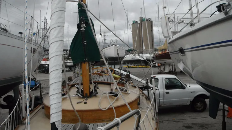 Slide: The Image of Sailboats in a marina with a 1987 Chip Stulen Faering Design 20 in the foreground. - 12