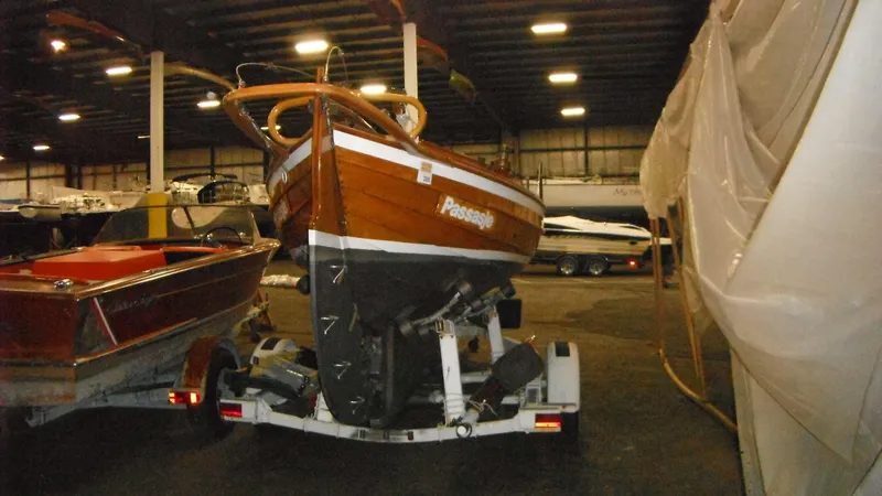 Slide: The Image of 1987 Chip Stulen Faering Design 20 boat on trailer in indoor storage facility. - 23