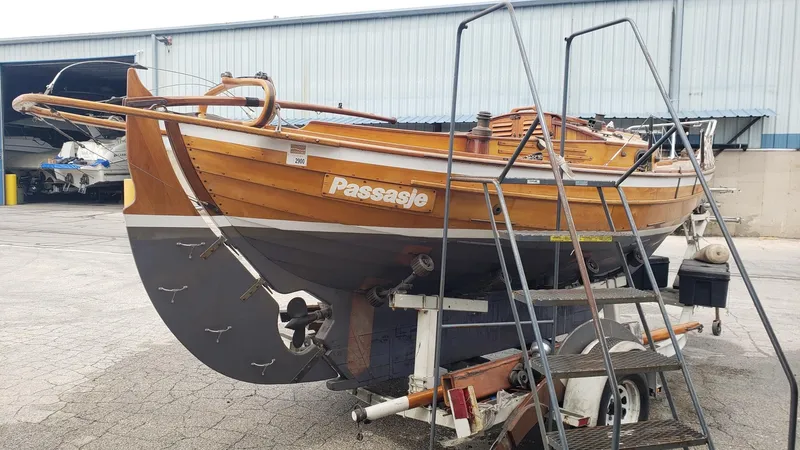 Slide: The Image of 1987 Chip Stulen Faering Design 20 boat on trailer, wooden hull, dockside view. - 5