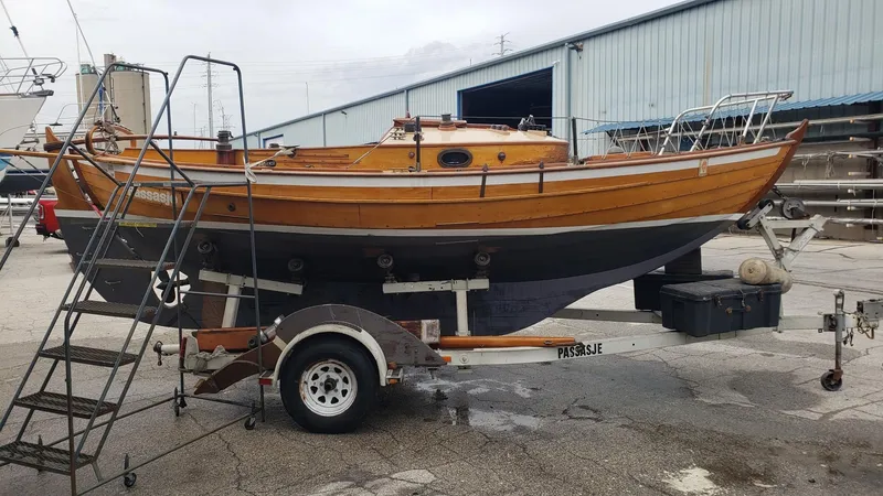 Slide: The Image of 1987 Chip Stulen Faering Design 20 boat on trailer in a shipyard. - 6