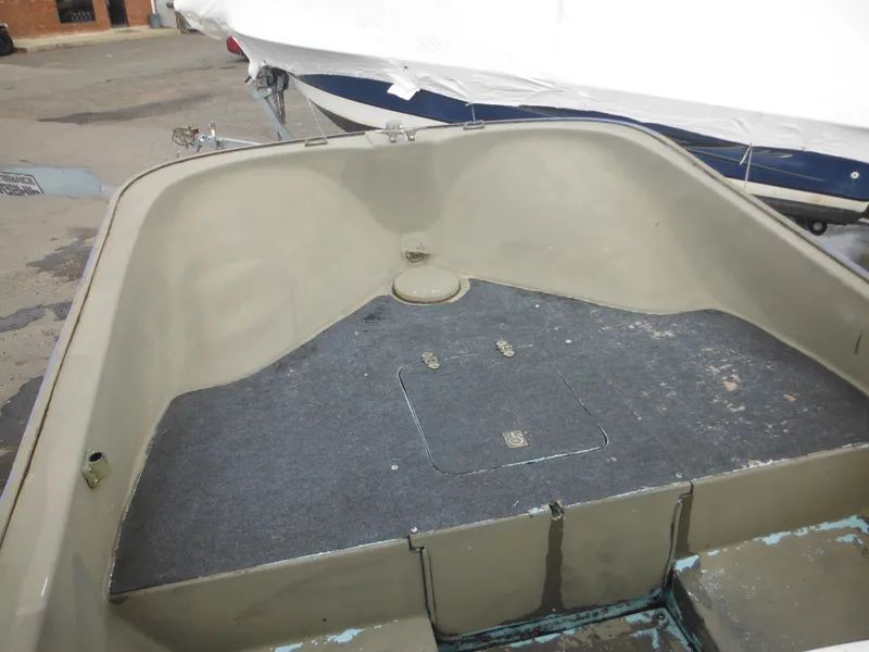 Slide: The Image of 1977 McKee Craft 17S boat interior, showing bow storage area. - 11