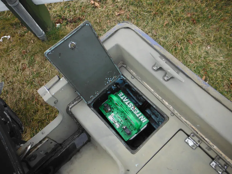 Slide: The Image of Battery compartment of a 1977 McKee Craft 17S boat with Interstate battery. - 19