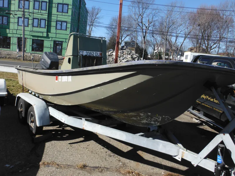 Slide: The Image of 1977 McKee Craft 17S boat on trailer in outdoor setting. - 2