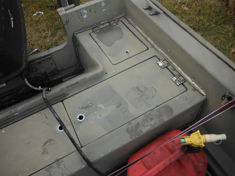 Slide: The Image of 1977 McKee Craft 17S boat interior with storage compartments. - 20