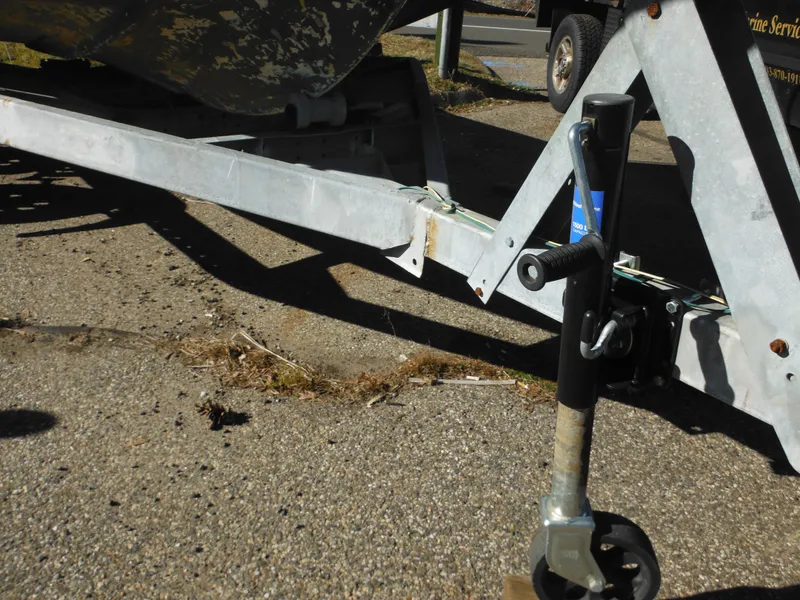 Slide: The Image of Close-up of a 1977 McKee Craft 17S boat trailer hitch and jack stand. - 4