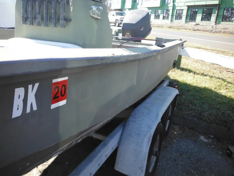 Slide: The Image of 1977 McKee Craft 17S boat on trailer, side view with registration sticker. - 5