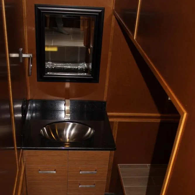 Slide: The Image of Compact bathroom in 2015 Bravada Evolution Share #7 with modern sink and mirror. - 11