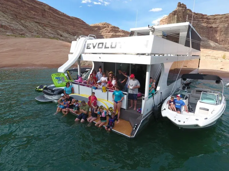 Slide: The Image of Group enjoying on 2015 Bravada Evolution Share #7 houseboat in scenic lake. - 3