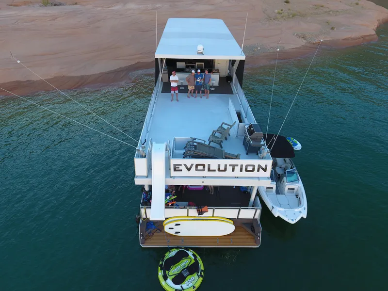 Slide: The Image of Aerial view of 2015 Bravada Evolution Share #7 houseboat on a lake. - 4