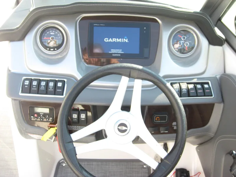 Slide: The Image of Dashboard of 2015 Chaparral 244 Sunesta boat with Garmin navigation system. - 11