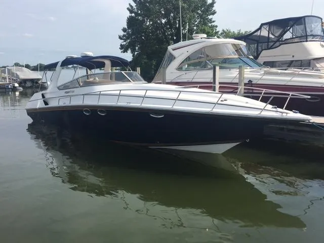 Slide: The Image of 2002 Fountain 38 Express Cruiser docked at marina. - 1