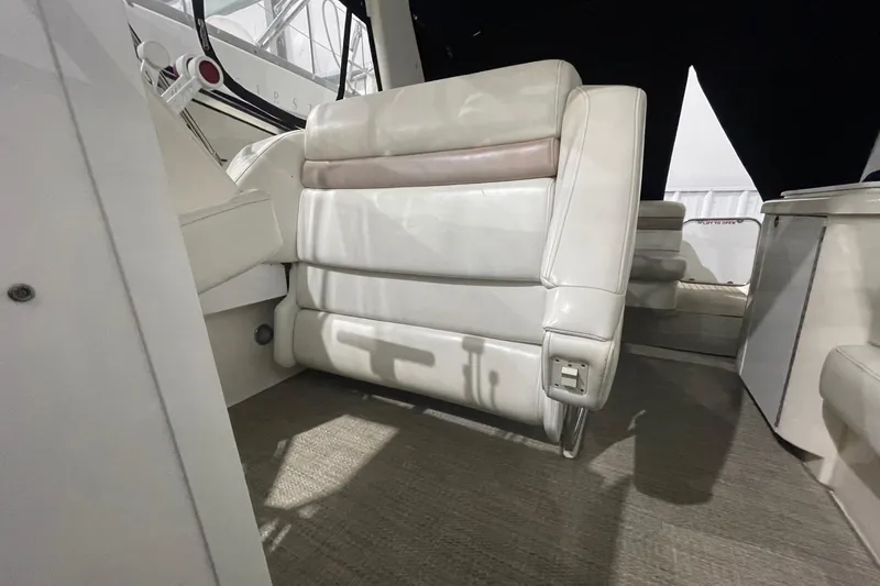 Slide: The Image of Interior of 2002 Fountain 38 Express Cruiser with white leather seating. - 11