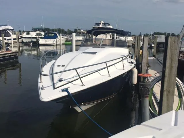 Slide: The Image of 2002 Fountain 38 Express Cruiser docked at marina. - 2
