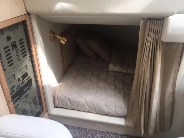 Slide: The Image of 2002 Fountain 38 Express Cruiser cabin interior with bed. - 21