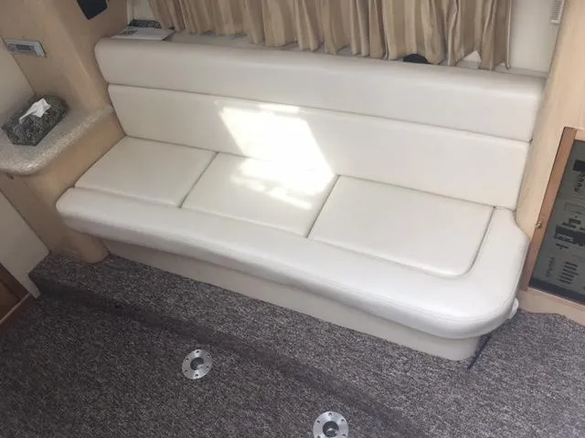 Slide: The Image of Interior of 2002 Fountain 38 Express Cruiser with white leather sofa. - 22
