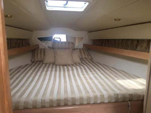 Slide: The Image of Interior of 2002 Fountain 38 Express Cruiser with cozy bed. - 25