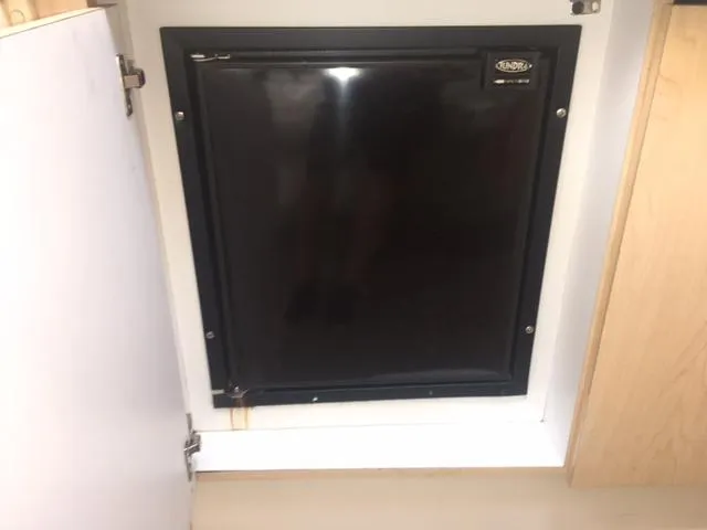 Slide: The Image of Black fridge in 2002 Fountain 38 Express Cruiser cabin. - 28