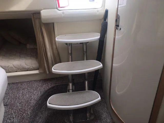 Slide: The Image of Interior of a 2002 Fountain 38 Express Cruiser with stairs. - 29