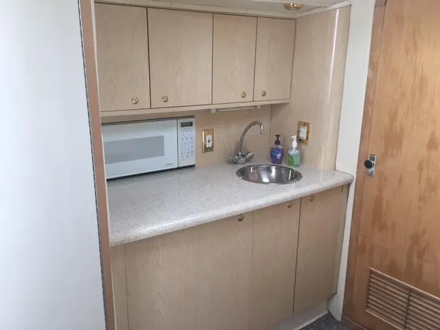 Slide: The Image of Galley in a 2002 Fountain 38 Express Cruiser yacht. - 31