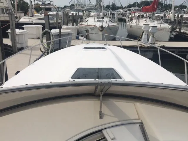 Slide: The Image of Fountain 38 Express Cruiser 2002 in harbor, front deck view. - 34