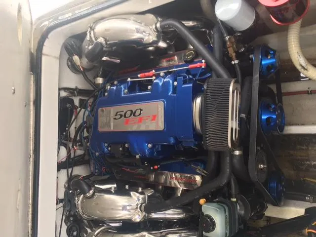 Slide: The Image of Engine of a 2002 Fountain 38 Express Cruiser boat. - 38