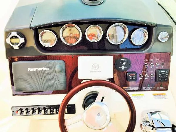 Slide: The Image of Control panel of 2013 Sea Ray 310 Sundancer boat with gauges and navigation equipment. - 17
