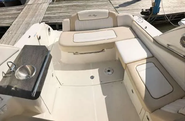 Slide: The Image of 2013 Sea Ray 310 Sundancer boat interior with seating and sink. - 25