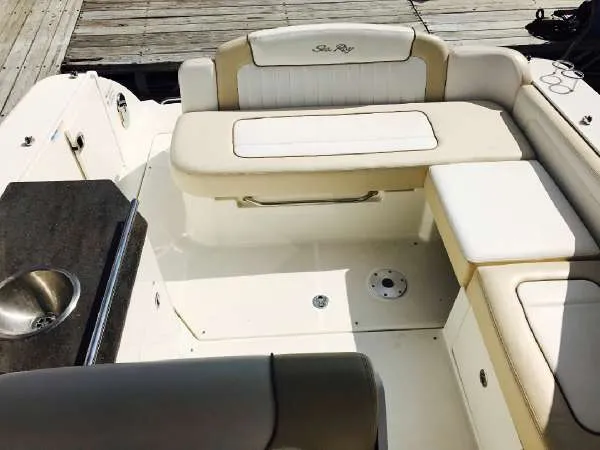 Slide: The Image of 2013 Sea Ray 310 Sundancer boat interior with seating and sink. - 27