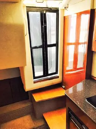 Slide: The Image of Interior of 2013 Sea Ray 310 Sundancer yacht with stairs and window. - 36