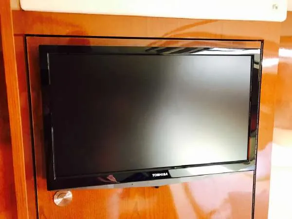 Slide: The Image of Toshiba TV mounted on 2013 Sea Ray 310 Sundancer yacht interior. - 38