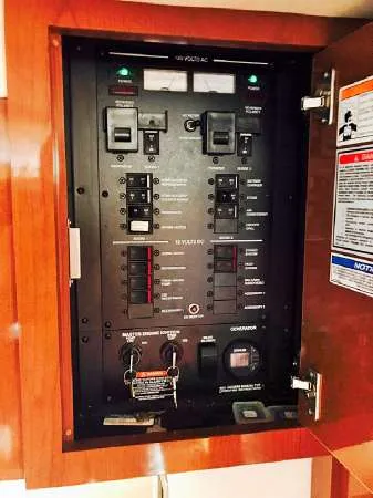 Slide: The Image of Electrical control panel inside 2013 Sea Ray 310 Sundancer boat. - 41