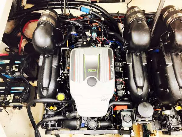 Slide: The Image of Engine compartment of 2013 Sea Ray 310 Sundancer boat, showcasing powerful machinery. - 43