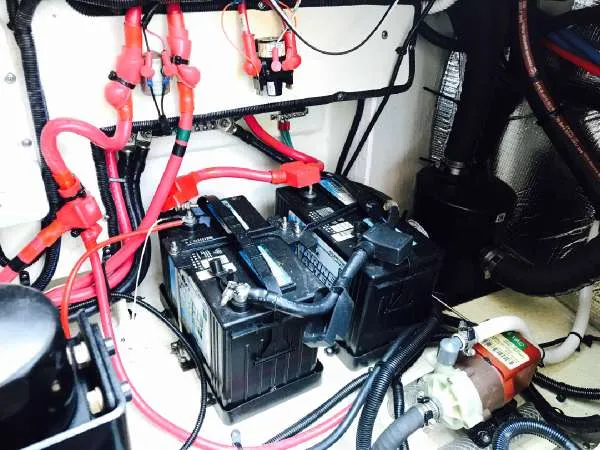 Slide: The Image of Engine compartment of 2013 Sea Ray 310 Sundancer with batteries and wiring. - 46