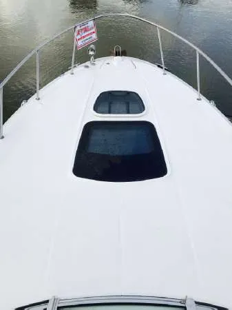 Slide: The Image of 2013 Sea Ray 310 Sundancer boat deck with water view. - 9