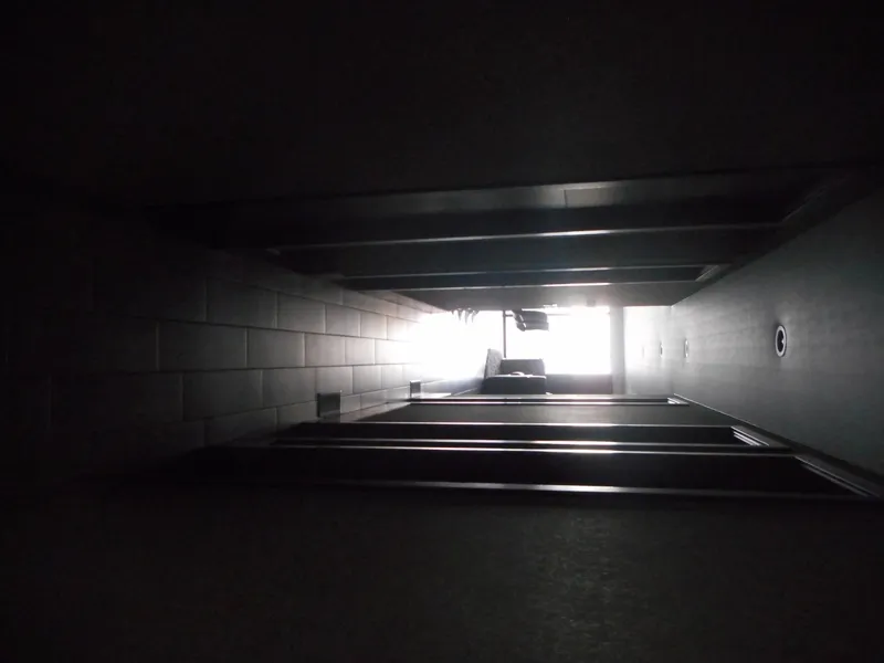 Slide: The Image of Dimly lit hallway with light at the end, captured by Adonia Liquidity Trip 5, 2017. - 15