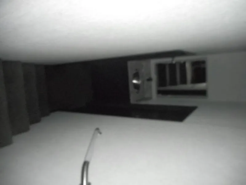 Slide: The Image of Dimly lit staircase with a handrail, leading to a dark doorway. - 19