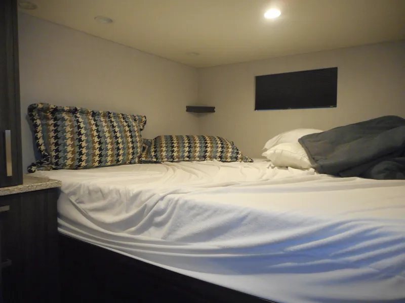 Slide: The Image of Cozy bed inside 2017 Adonia Liquidity Trip 5 RV with patterned pillows and soft lighting. - 20