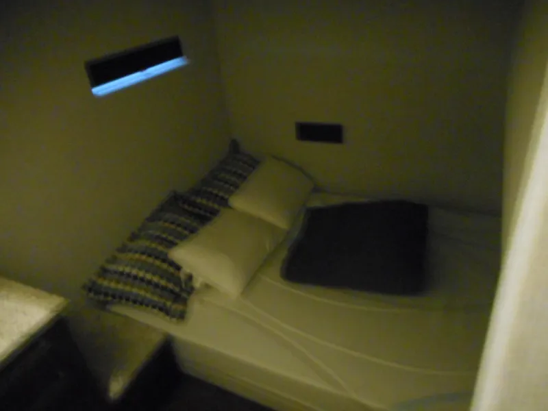 Slide: The Image of Cozy cabin interior of Adonia Liquidity Trip 5, 2017 model, with bed and pillows. - 23