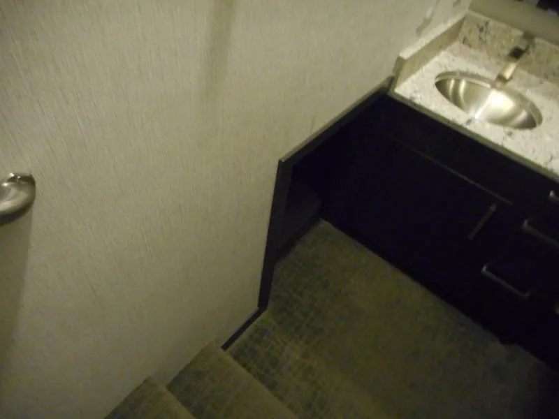 Slide: The Image of Staircase leading to a compact bathroom with a sink, Adonia Liquidity Trip 5, 2017. - 24