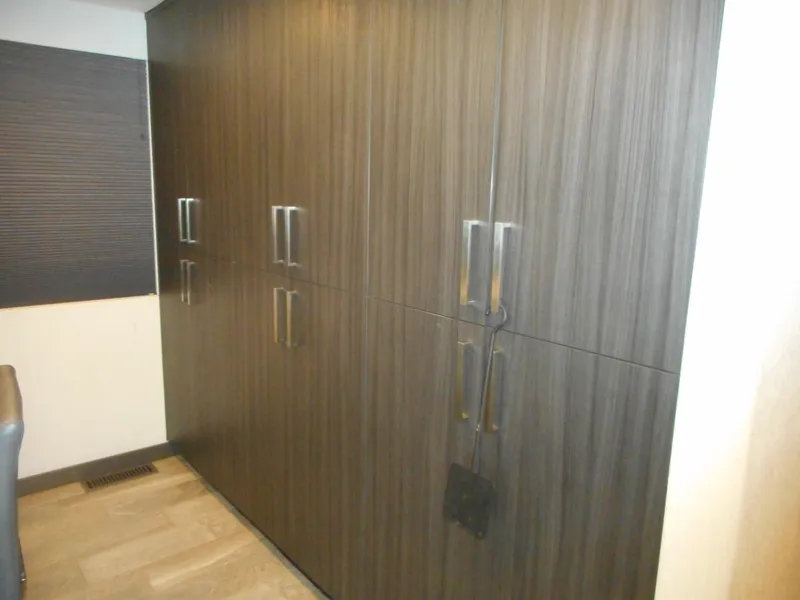 Slide: The Image of Wooden cabinets with sleek handles in a modern interior, Adonia Liquidity Trip 5, 2017. - 25