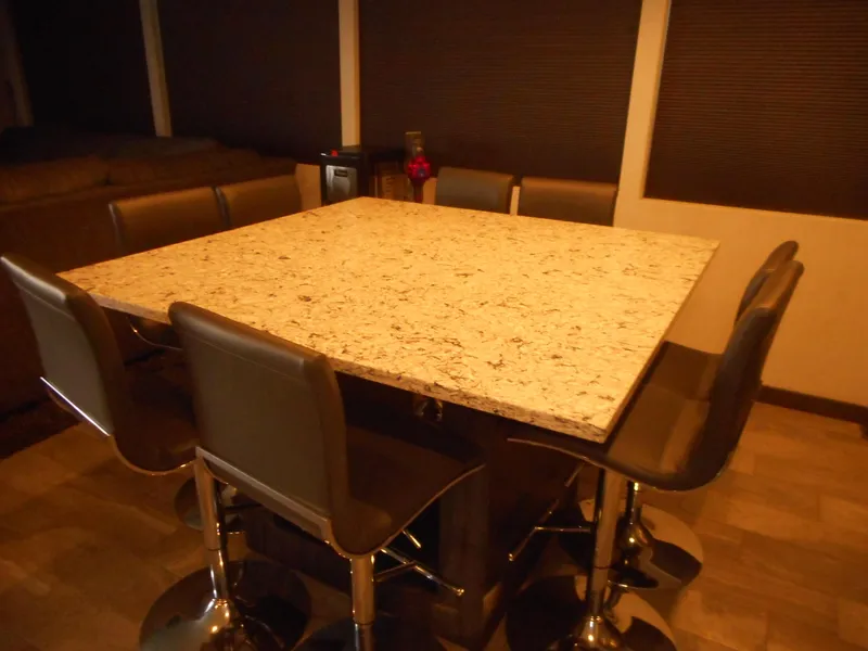 Slide: The Image of Luxurious dining area with granite table and leather chairs in Adonia Liquidity Trip 5, 2017. - 26